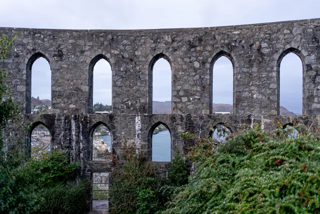 The arched stone walls of McCaig's Tower in Oban, Scotland.