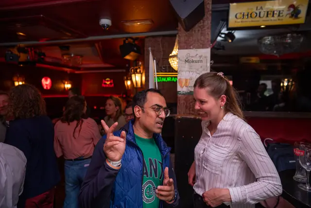 Guests laughing together at an event.